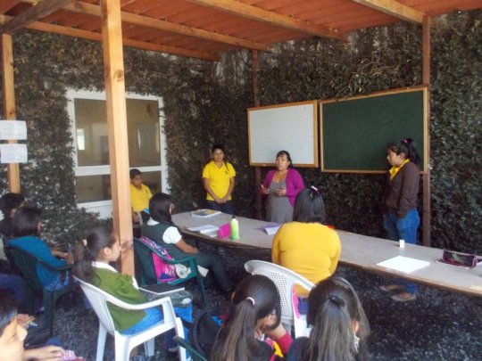 Marisol teaching a class at La Academia