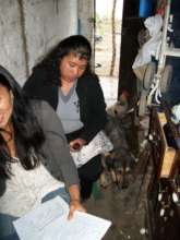 Marisol doing home visits 2012