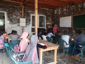 Jacqueline teaching English to her schoolmates