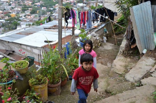 The approach to her former home in the slums