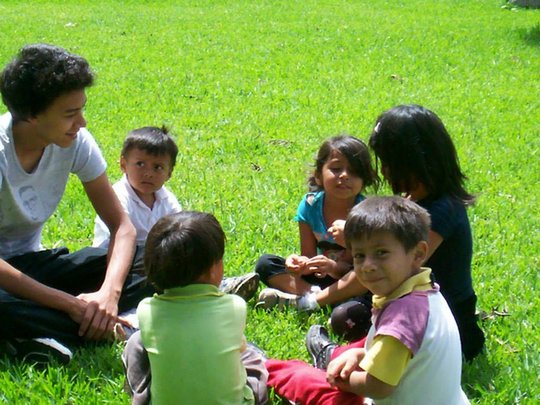 Anival, a gym teacher with the kids for a class