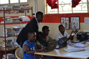 Issac teaching community members computer basics
