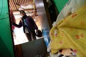 Nurse Rina entering patient's home