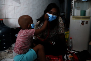 Ais roleplaying as a doctor with her mother