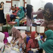 Nurses practicing clinical skills in class