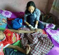 Nurse Yuni visiting her patient at home
