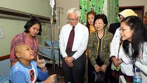 President Tony Tan and Mrs Mary Tan with a patient
