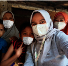 Sasha with her family and Nurse Putri