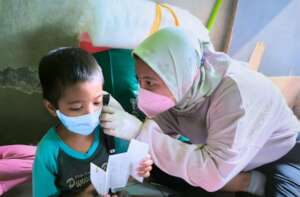 Billa with Nurse Eka during home care