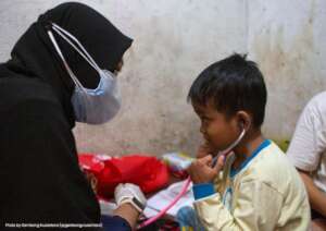 A patient is being playful with our nurse