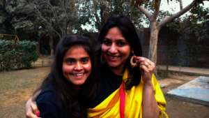 Neeta with a happy customer wearing the earings she designed.jpg