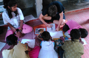 Pallav's son Arjun learning paper bag making