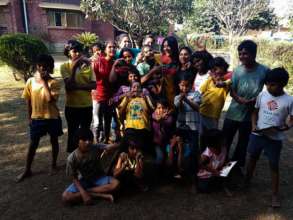 Visitors having fun with kids at Karm Marg.jpg