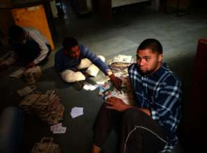 Young Adults with Special needs making newpaper bags.jpg