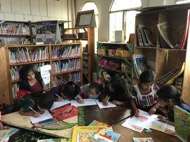 Margarita working on art projects with her friends