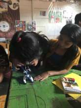 The students were eager to inspect items up close