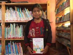 Reading club member Mirsa with her favorite book.
