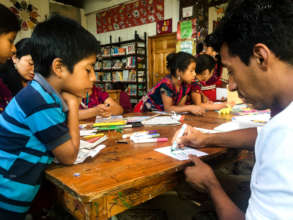 Volunteer intern Wilder teaching art class