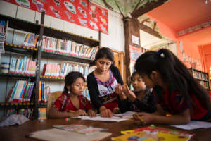 Olga providing support to young learners