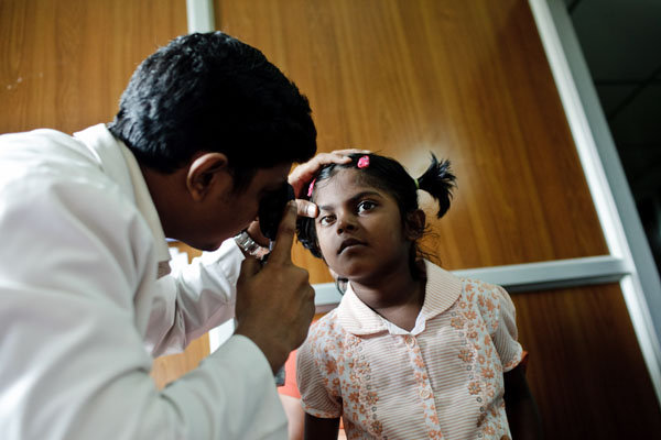 Eight-year old Sheha has her vision checked.