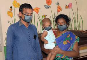 Nancy and her parents at Aravind Eye Hospital.