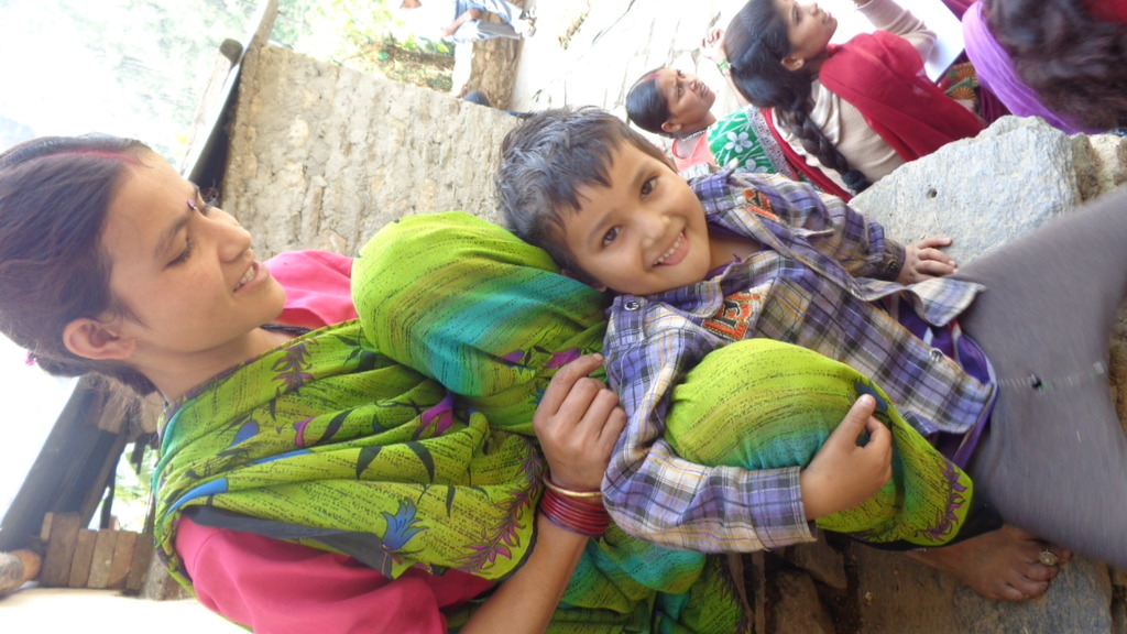 Mother and child at a improved cookstove workshop