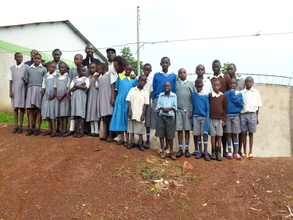 A few students in front of tank