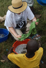 Kim helping slum children