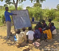 Stable, a volunteer teacher, teaching his class