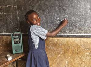 Jane writes her name on the blackboard