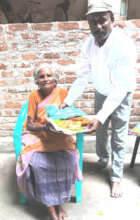 One Beneficiary aged woman getting dress