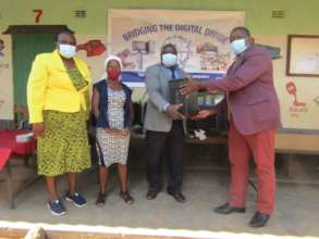 Our Director Donating Computers To Mbeure Primary
