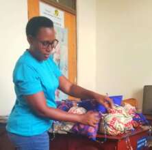 Daphrose, our local coordinator, with dignity bags