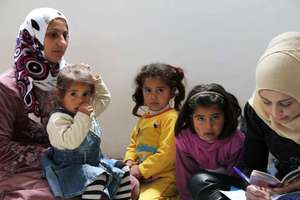 Members of a Syrian family register as refugees