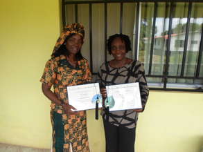 Grace & Vaiba displaying the Graduate Certificates