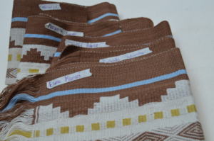 Inti textiles with artisan name of who made them