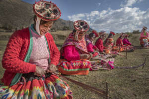 Sonia and Matilda prepare weavings for tourists.