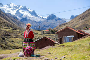 Artisan from Kelkanca in front of her home