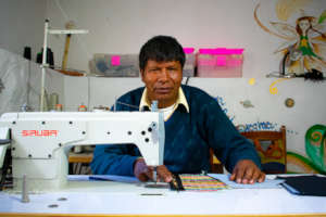 Senor Tomas sewing