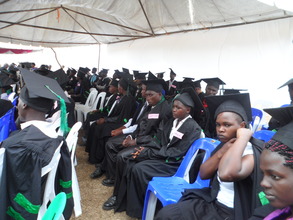 pass outs dressed in the graduation gowns