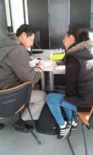 Uriel and her trainer developing his business plan