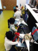 Younger kids learning to do traditional pinatas!