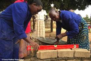 GWWI in Moyo - leveling each brick and each layer