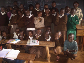 Irene (left of child in green) with her classmates