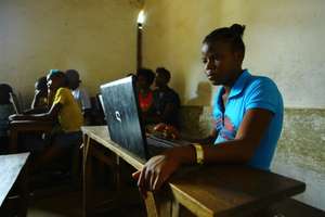 Students working with new laptops