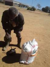 Old man collects bag of maize after walking 44km