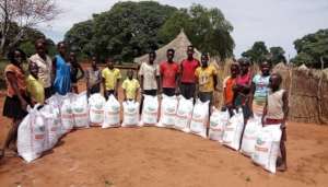 Distribution of ground maize to orphans