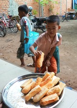 Children collecting their baguette before class