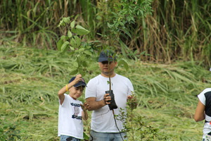 Family volunteers planting at La Reserva