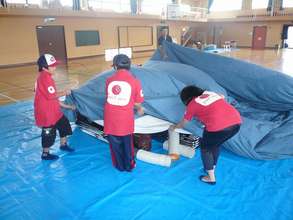 4th grade boys help to build the planetarium dome.